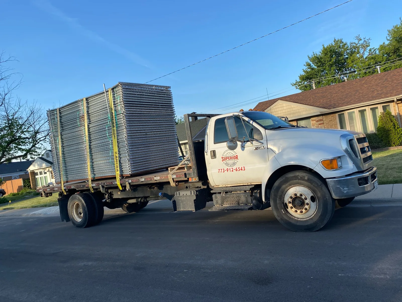 Superior Rent-A-Fence truck delivering temporary fence panels