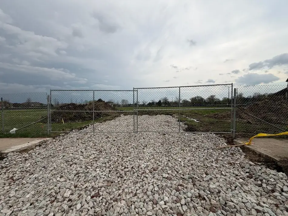6 by 24 foot double swing gate at a gravel entrance