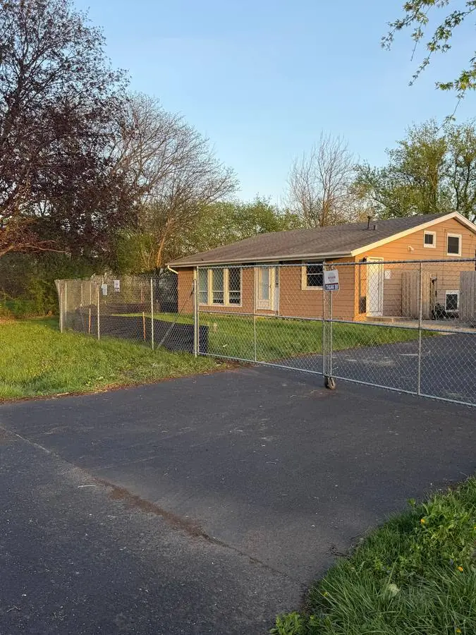 Temporary chain link fence around a residential property perimeter
