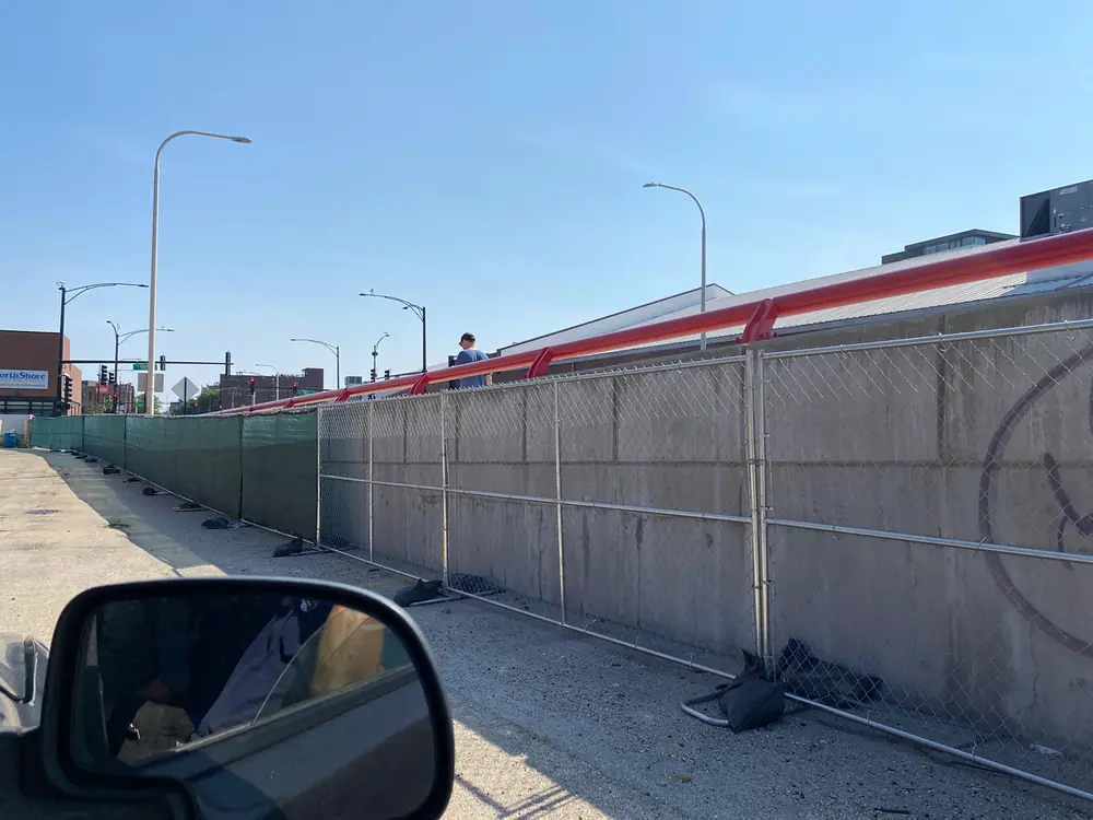 6'x12' temporary fence panels with sandbag bases on a commercial project